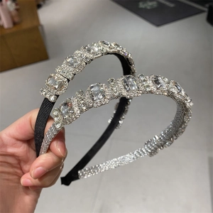 Detailed view of luxury geometric leaf headbands featuring high-quality sparkling rhinestones