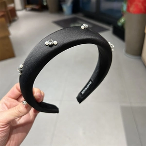 Padded black satin headband with elegant pearls and rhinestones for women hair styling