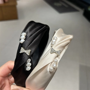 Satin pearl headbands set with rhinestone bow ornaments in black and beige silk fabric