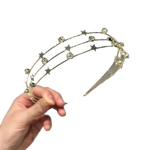 Elegant gold multi-layer star headband with sparkling rhinestones and metal finish