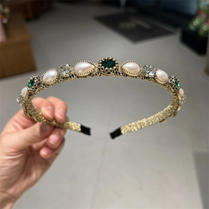 Vintage style gold woven headband with pearls and emerald green rhinestones detail