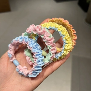 Close-up of macaron color pleated fabric hair ties with durable plastic buckles