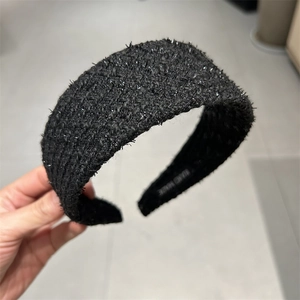 Classic black tweed braided headband with shimmer details for an elegant retro hair style