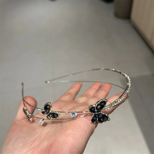 Elegant double-layered silver headband with black butterfly charms and sparkling zircon crystals
