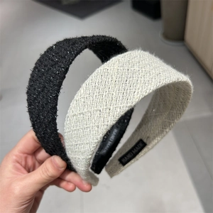Detail showing handmade tweed headbands with woven textures and sequin accents