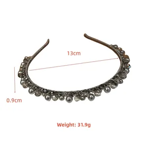 Detailed view of hand-woven grey crystal and faux pearl headband with 13cm width
