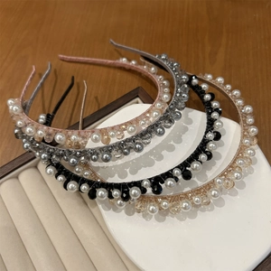 Set of four handmade crystal and pearl headbands in elegant pastel colors for women