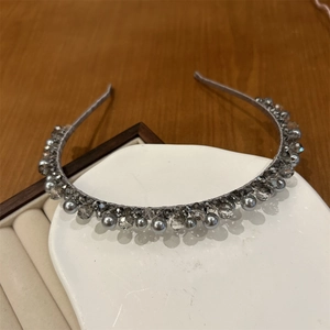 Detail of hand-wrapped grey crystals and faux pearls on a slim luxury headband