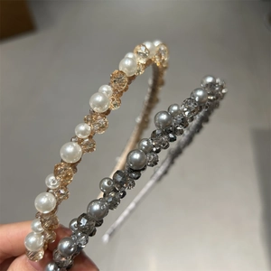Detailed view of handmade crystal headbands with elegant pearls and sparkling beads