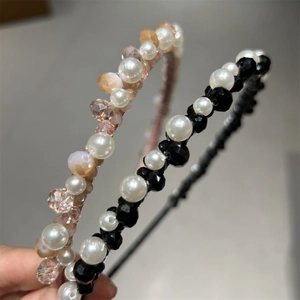 Detailed view of handmade crystal beaded headbands with pink and black beads and pearls