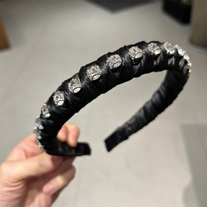 Elegant black satin padded headband with sparkly rhinestone crystals for women