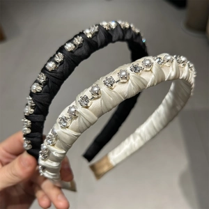 Detailed view of silk hairbands with hand-set pearls and shimmering rhinestones