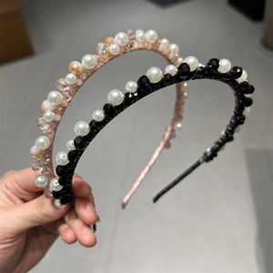 Close-up of handmade crystal headband with hand-wound pearls and faceted beads detail