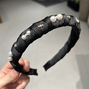 Elegant black satin padded headband with white faux pearls and gold bead accents