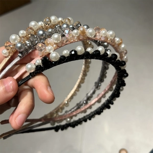 Close-up of handmade beaded headbands with luxury crystal glass beads and faux pearls