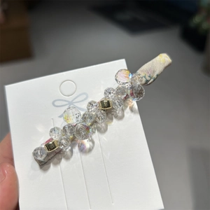 Minimalist handmade crystal hair clip with floral fabric lining and gold metal clip