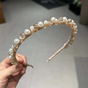 Elegant handmade headband featuring alternating cream pearls and amber faceted crystal beads