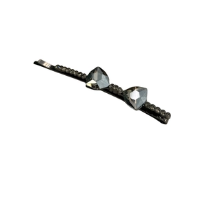 Elegant dark grey crystal bow hair clip featuring geometric rhinestones on metal base
