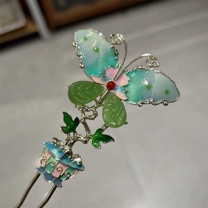Traditional U-shaped hair pin featuring an enamel butterfly and colorful floral motifs