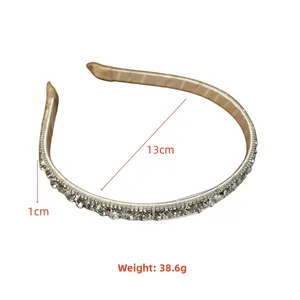 Detailed view of silver rhinestone headband with dimensions 13cm diameter and 1cm width