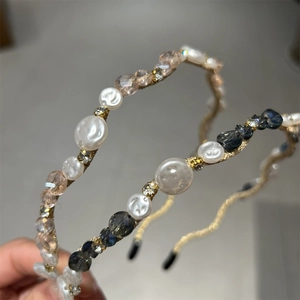 Detail of beaded headband with pink and blue crystal beads and white baroque pearls