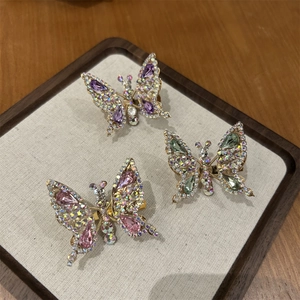 Set di tre fermagli per capelli a farfalla scintillanti con strass colorati in finitura oro
