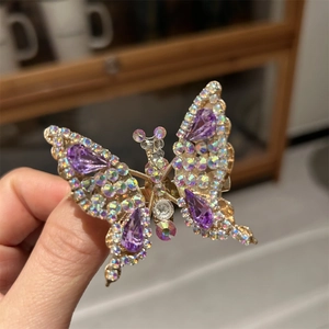 Molletta per capelli a farfalla dorata con gemme viola e strass cangianti brillanti