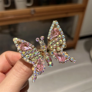 Elegante molletta a farfalla dorata con cristallo rosa e strass luccicanti tipo AB