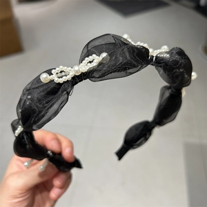 Elegant black organza headband with white pearls for a high skull top hairstyle look