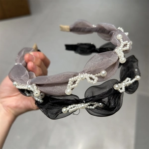 Elegant organza pearl bow headbands in grey and black with textured pleated design
