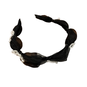 Elegant black organza headband with delicate white pearl accents on white background