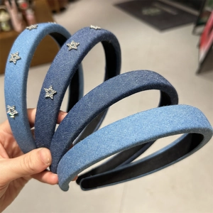 Detail of denim headbands with sparkling zircon stars and non-slip lining