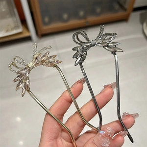 Elegant U-shaped hairpins with crystal bow design in gold and silver finishes