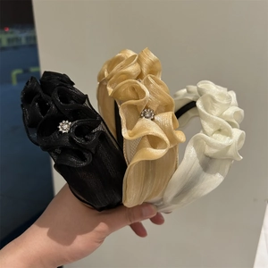 Detail view of layered organza headbands with subtle sparkles and small rhinestone accents