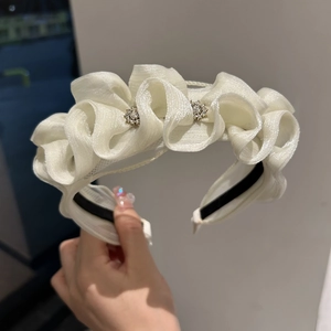 Elegant white organza ruffled headband with sparkling rhinestone flower accents for women