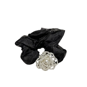Elegant black shimmering organza scrunchie featuring a white beaded pearl camellia flower
