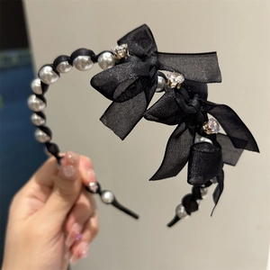 Elegant black ribbon and pearl headband featuring delicate translucent bows and rhinestones