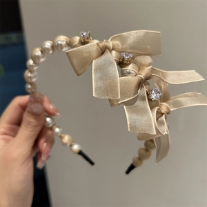 Elegant champagne silk bow headband with faux pearls and rhinestones for women