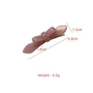 Detail showing dimensions of the pink acetate bow hair clip with golden metal clip