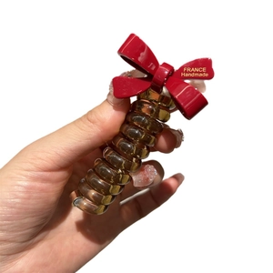 Red bow hair tie with amber spiral phone cord and France Handmade gold lettering