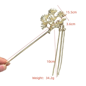 Detailed size specifications of a gold pine branch hair stick with metal tassels