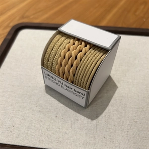 High elasticity woven hair ties set in earthy tones displayed on a minimalist tray