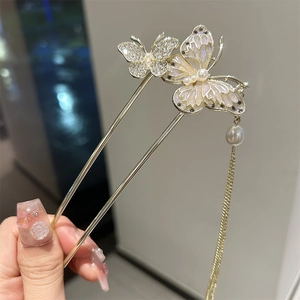 Elegant gold butterfly hair stick with long pearl tassels and shimmering crystal wings