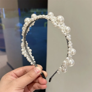Detail of handmade faux pearl floral headband with beaded embroidery and comfort end caps