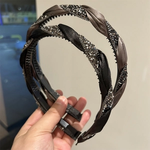 Detail of twisted woven headband with sparkling rhinestones and non-slip inner teeth