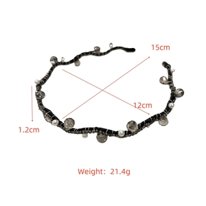 Detail view of woven black headband with crystals, smoky stones and faux pearls