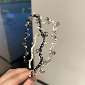 Elegant thin crystal headbands with pearls and rhinestones on wave-shaped metal frames