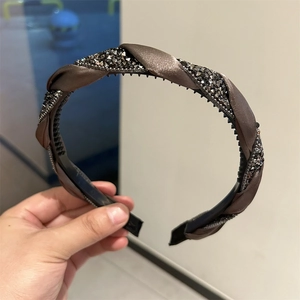 Braided brown satin headband with sparkling dark crystals and a non-slip grip design