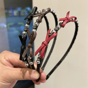 Three-piece set of elegant rhinestone bow headbands in black, brown, and red colors