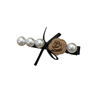 Elegant Korean spring hair clip with brown resin rose and white pearls on black ribbon